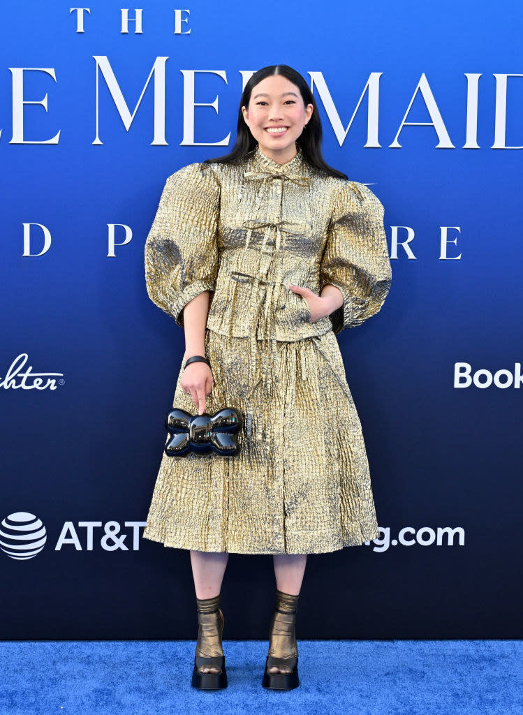 Awkwafina at "The Little Mermaid" premiere in a short metallic dress with large sleeves