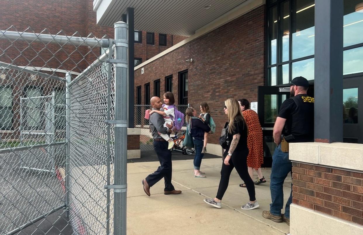 Parents and children are reunited in Mount Horeb, WI on Wednesday May 1, 2024.  The Mount Horeb school system went on lockdown because of an active shooter.
