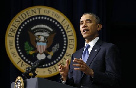 U.S. President Barack Obama pauses while speaking at the White House Youth Summit on the Affordable Care Act in Washington December 4, 2013. REUTERS/Kevin Lamarque