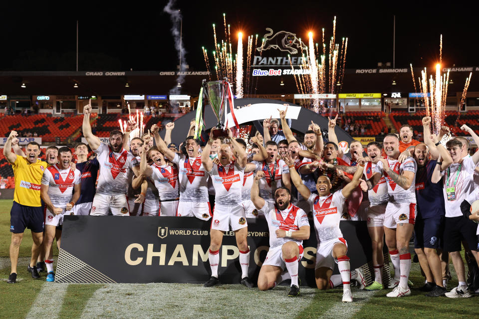 PENRITH, AUSTRALIA - FEBRUARY 18: St Helens ccelebrate with the World Club Challenge trophy after victory during the World Club Challenge and NRL Trial Match between the Penrith Panthers and St Helens at BlueBet Stadium on February 18, 2023 in Penrith, Australia. (Photo by Mark Metcalfe/Getty Images)