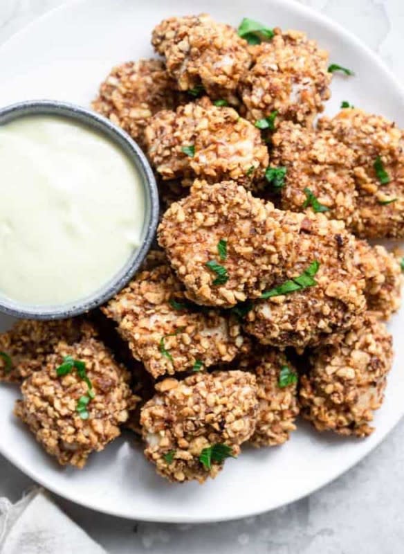 <p>Food Faith Fitness</p><p>These baked chicken bites only take six ingredients and are ready in 20 minutes.</p><p><strong>Get the recipe: <a href="https://www.foodfaithfitness.com/almond-crusted-chicken-bites-honey-mustard-dip/" rel="nofollow noopener" target="_blank" data-ylk="slk:Almond Crusted Chicken Bites;elm:context_link;itc:0;sec:content-canvas" class="link ">Almond Crusted Chicken Bites</a></strong></p>