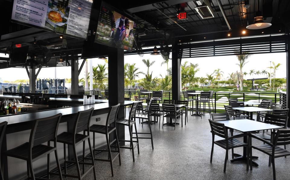 The outdoor restaurant at PopStoke overlooks the putting courses. PopStroke is a golf and outdoor dining venue that features two 18-hole putting courses designed by Tiger Woods. The Sarasota location, on the west side of University Town Center, will open to the public at noon on Thursday, Apr. 28th, 2022. 