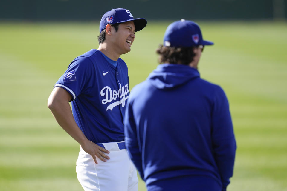 Los Angeles Dodgers designated hitter Shohei Ohtani (17) participates in spring training baseball workouts at Camelback Ranch in Phoenix, Sunday, Feb. 18, 2024. (AP Photo/Ashley Landis)