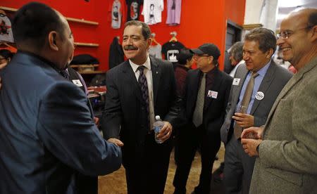 Chicago Mayoral candidate Jesus "Chuy" Garcia (2nd L) greets supporters at a rally in Chicago, Illinois, January 15, 2015. REUTERS/Jim Young