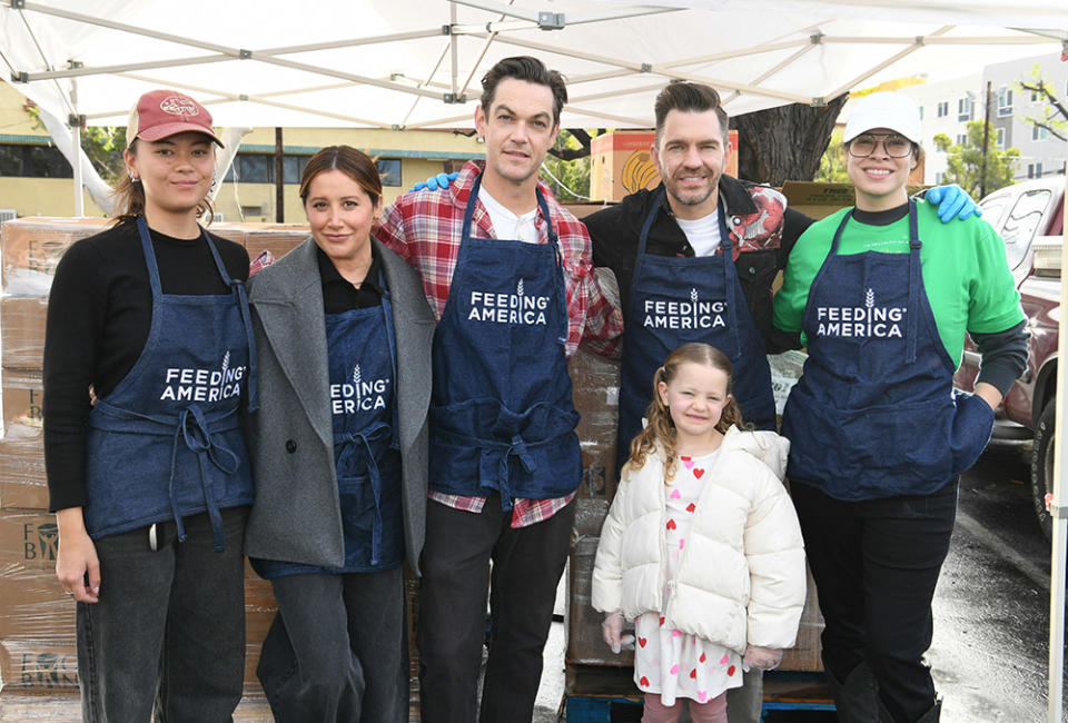 Lukita Maxwell, Ashley Tisdale, Christopher French, Andy Grammer and Cara Jade Myers volunteer as Feeding America hosts Holiday Volunteer Opportunity at North Valley Caring Services on December 22, 2023 in North Hills, California.