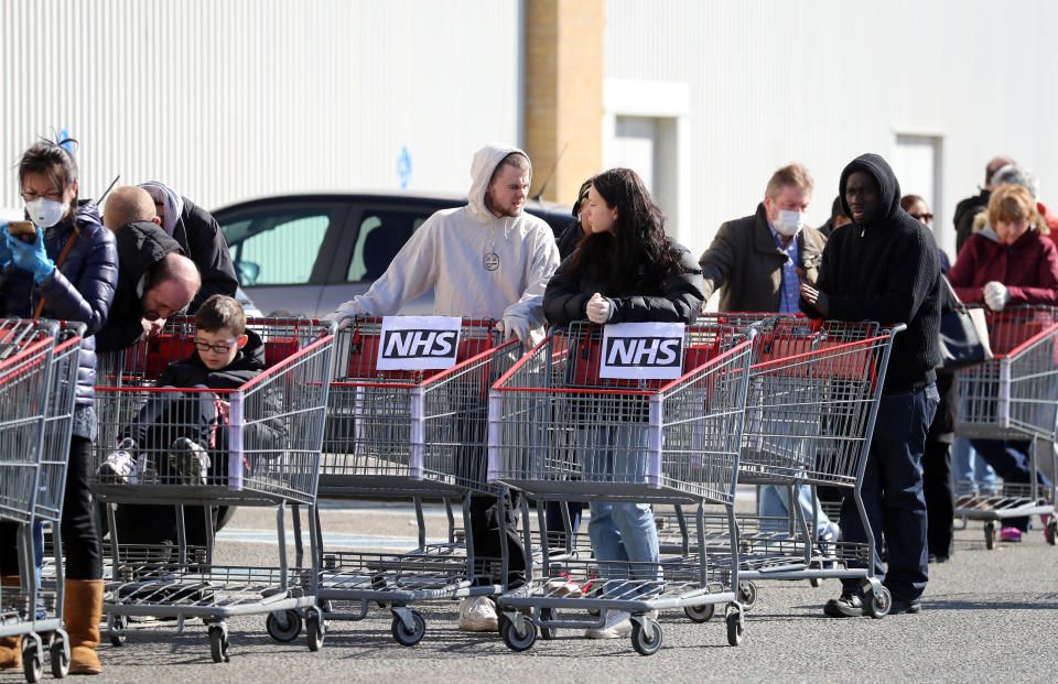 NHS workers queue outside Costco in Thurrock , as Prime Minister Boris Johnson has said the Government is ready to impose tougher restrictions to curb the spread of the coronavirus if people do not follow the guidance on social distancing. (Photo by Joe Giddens/PA Images via Getty Images)