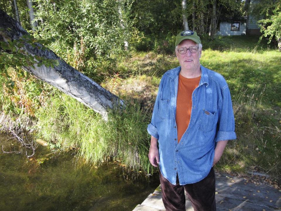 FILE - In this Sept. 3, 2010 file photo, author Joe McGinniss, who is working on a book on former Alaska Gov. Sarah Palin, poses for a photograph at the home he's renting next to Palin's home in Wasilla, Alaska. McGinniss, the adventurous and news-making author and reporter who skewered the marketing of Richard Nixon in "The Selling of the President 1968" and tracked his personal journey from sympathizer to scourge of convicted killer Jeffrey MacDonald in the blockbuster "Fatal Vision," died Monday, March 10, 2014, at age 71. McGinniss, who announced in 2013 that he had been diagnosed with inoperable prostate cancer, died from complications related to his disease. (AP Photo/Dan Joling, file)