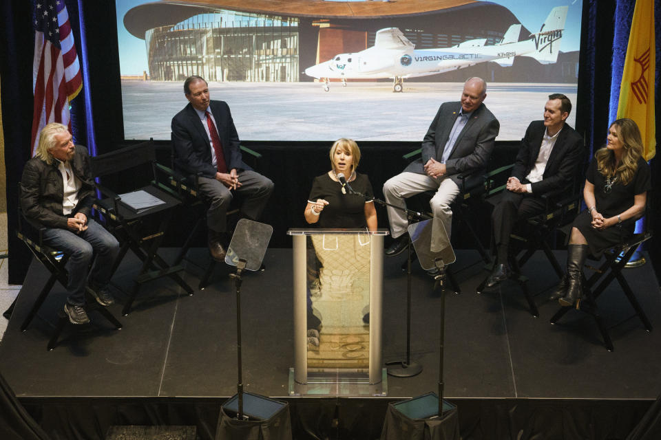 New Mexico Gov. Michelle Lujan Grisham speaks during an event announcing Virgin Galactic's move to New Mexico Friday, May 10, 2019, at the state capital in Santa Fe, N.M. The company says it is nearing the first commercial flights from the Spaceport America. (AP Photo/Craig Fritz)