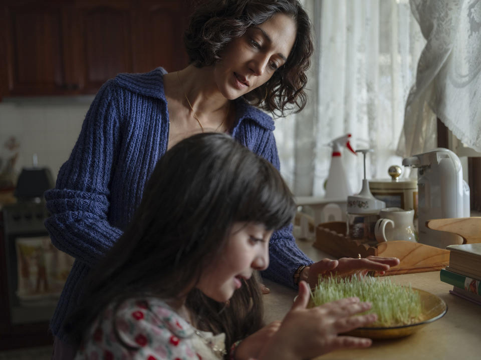 This image released by Sony Pictures Classics shows Zar Amir Ebrahimi, background, and Selina Zahednia in a scene from "Shayda." (Jane Zhang/Sony Pictures Classics via AP)