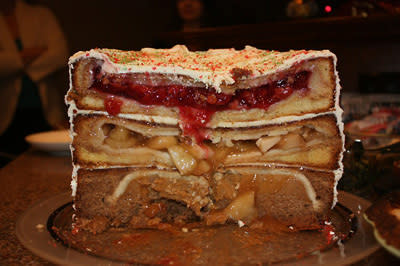 On the bottom is a pumpkin pie, inside a spice cake. In the middle is an apple pie inside a yellow cake. And on top is a cherry pie inside a white cake, covered in cream cheese frosting. The sugar high from this cake/pie would be enough to keep you buzzing for at least a week.