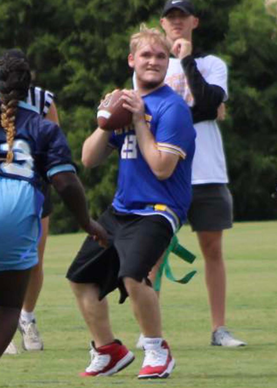 Unified Partner Josh Smith aims the ball carefully during the Special Olympics regional flag football invitational at the UT RecSports Field on Sutherland Avenue in Knoxville, Tennessee, Sept. 9, 2023.