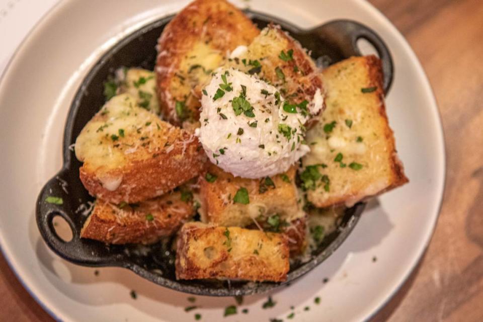 White Truffle Garlic Bread at North Italia:  Housemade ricotta, mozzarella, grana padano, herbs.