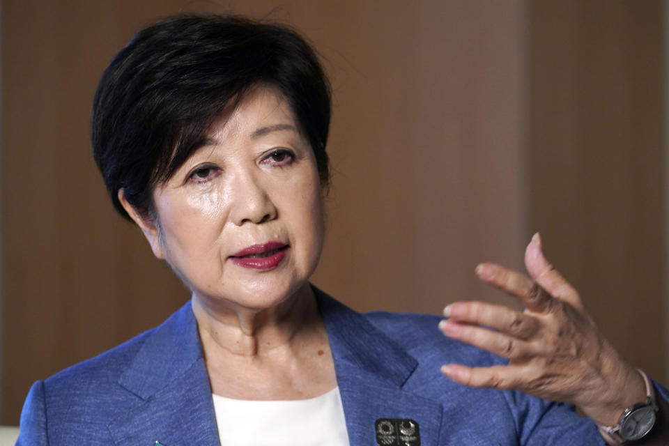 Tokyo Gov. Yuriko Koike speaks during an exclusive interview with The Associated Press at her office of the Tokyo Metropolitan Government Building in Tokyo Wednesday, June 17, 2020, ahead of a two-week campaigning for the election. A political go-getter, Koike even had the coronavirus crisis turn in her favor. And she repeatedly upstaged Prime Minister Shinzo Abe by taking more proactive steps ahead of him, gaining public support. Timing is also on her side now, she is cruising to a certain victory in the July 5 election for her second term as head of the Japanese capital. (AP Photo/Eugene Hoshiko)