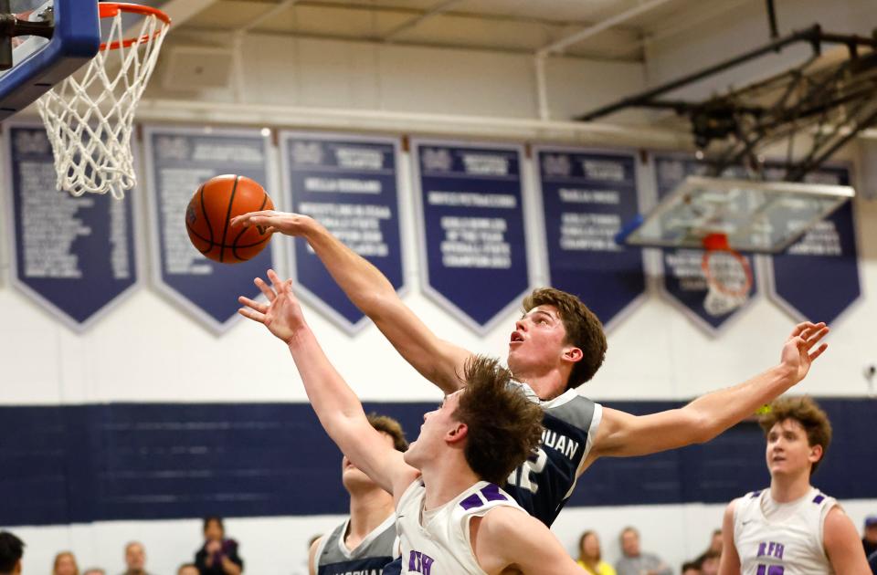 Griffin Linstra (12) of Manasquan blocks the shot of Brandon Kunz (1) of Rumson-Fair Haven during the NJSIAA Central Group 2 final at Manasquan High School in Manasquan, N.J. on Friday, March 3, 2024 (Credit: Noah K. Murray)