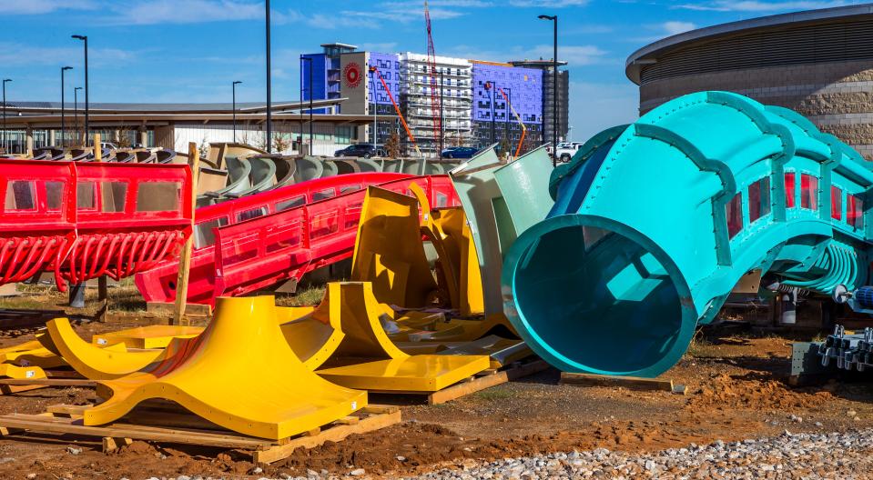 Water park slide parts are stacked up as crews continue work on the OKANA Resort along the Oklahoma River.