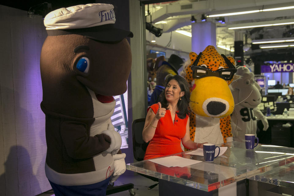 <p>Yahoo Finance Anchor and Reporter Alexis Christoforous is flanked by company mascots Fudgie the Whale and Chester the Cheetah, brought in as interns for the day at Yahoo Studios in New York City on Sept. 25, 2017. (Photo: Gordon Donovan/Yahoo News) </p>