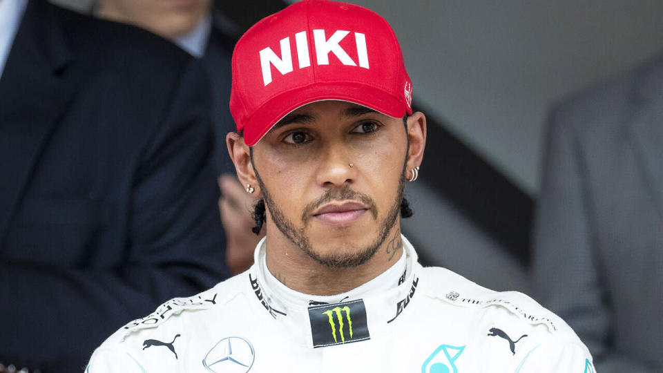 Lewis Hamilton, pictured after winning the Monaco GP, was furious at his team mid-race after being left on worn tyres.