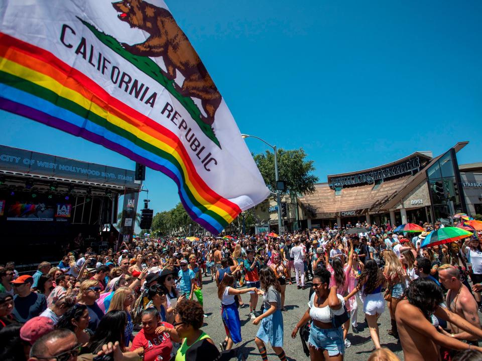 People participate in the annual LA Pride Parade in West Hollywood, California.