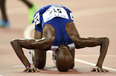 Mo Farah of Britain reacts after winning the men's 5000 metres final at the 15th IAAF Championships at the National Stadium in Beijing, China August 29, 2015. REUTERS/Dylan Martinez