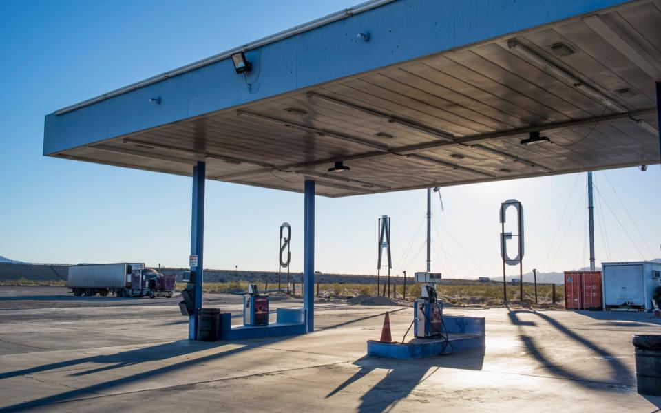 Empty gas station in a remote landscape