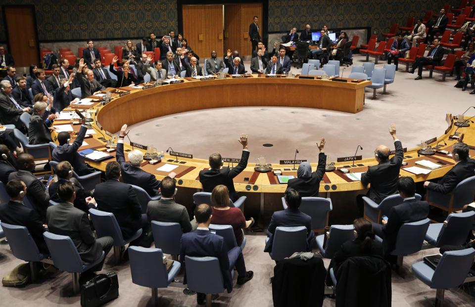 The U.N. Security Council votes unanimously to adopt a resolution concerning humanitarian aid in Syria at United Nations headquarters, Monday, Dec. 19, 2016. The resolution urges immediate deployment of United Nations monitors to former rebel-held eastern Aleppo, which France says is critical to prevent "mass atrocities" by Syrian forces, and especially militias. (AP Photo/Seth Wenig)