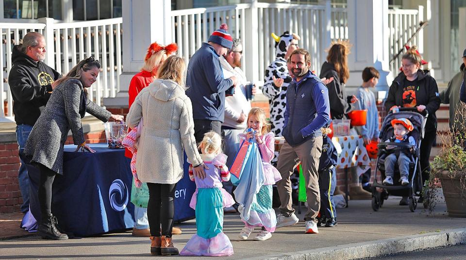 Front Street in Scituate, Massachusetts, is closed to traffic so families can trick-or-treat safely during Halloween on the Harbor on Oct. 31, 2023.