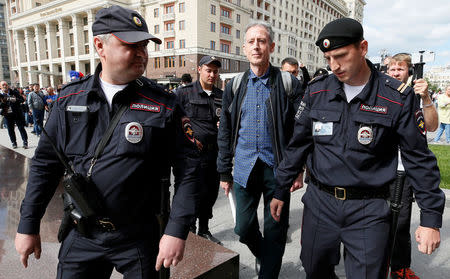 Veteran British LGBT rights campaigner Peter Tatchell is detained by police officers during a one-man protest to draw attention to what he said were appalling human rights abuses committed against gay men in Chechnya, in central Moscow, Russia June 14, 2018. REUTERS/Glab Garanich