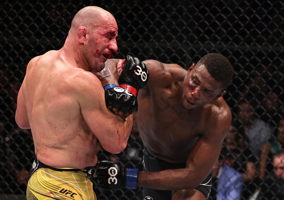 Jamahal Hill (right) punches Glover Teixeira in the UFC light heavyweight championship fight during at UFC 283 on January 21, 2023 in Rio de Janeiro, Brazil. (Photo by Buda Mendes/Zuffa LLC via Getty Images)