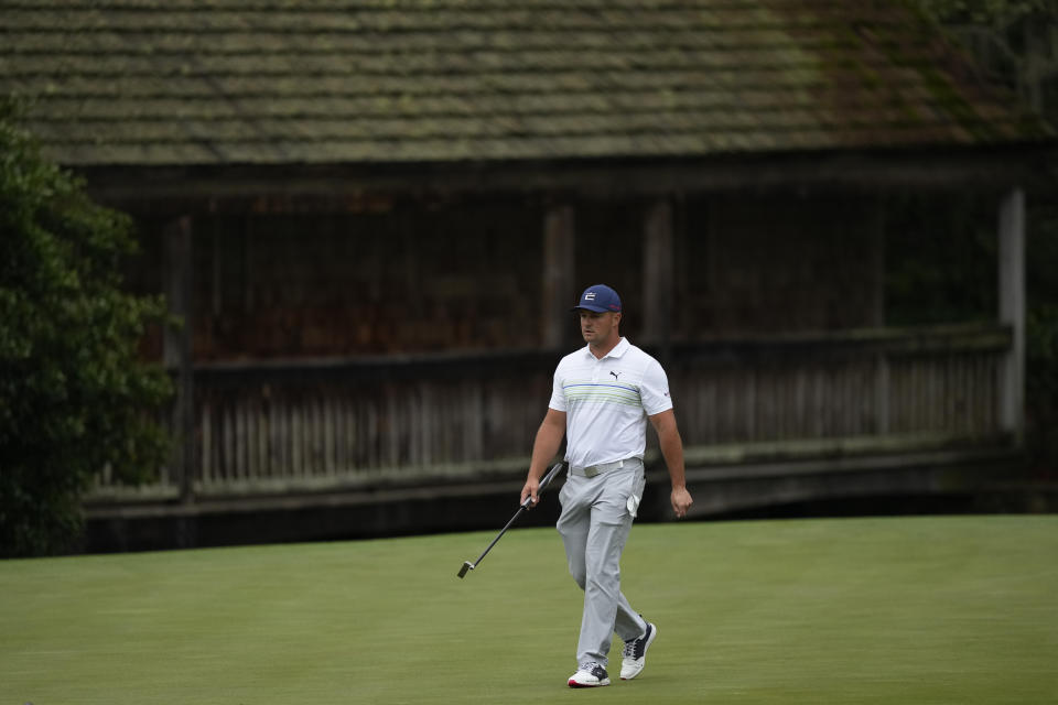 Bryson DeChambeau walks on the 11th green during a practice round for the Masters golf tournament on Wednesday, April 6, 2022, in Augusta, Ga. (AP Photo/Matt Slocum)