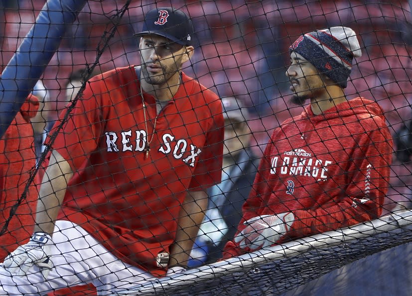 J.D. Martinez (L) and Mookie Betts may be looking at new roles for the Red Sox during the World Series. (AP)