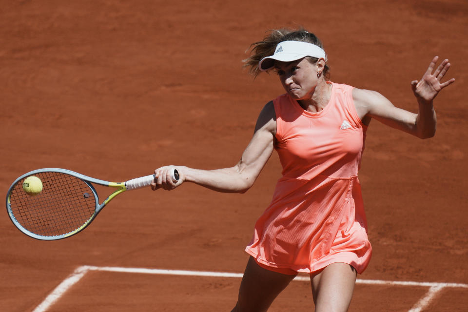 Aliaksandra Sasnovich of Belarus returns the ball to Britain's Emma Raducanu during their second round match of the French Open tennis tournament at the Roland Garros stadium Wednesday, May 25, 2022 in Paris. (AP Photo/Thibault Camus)