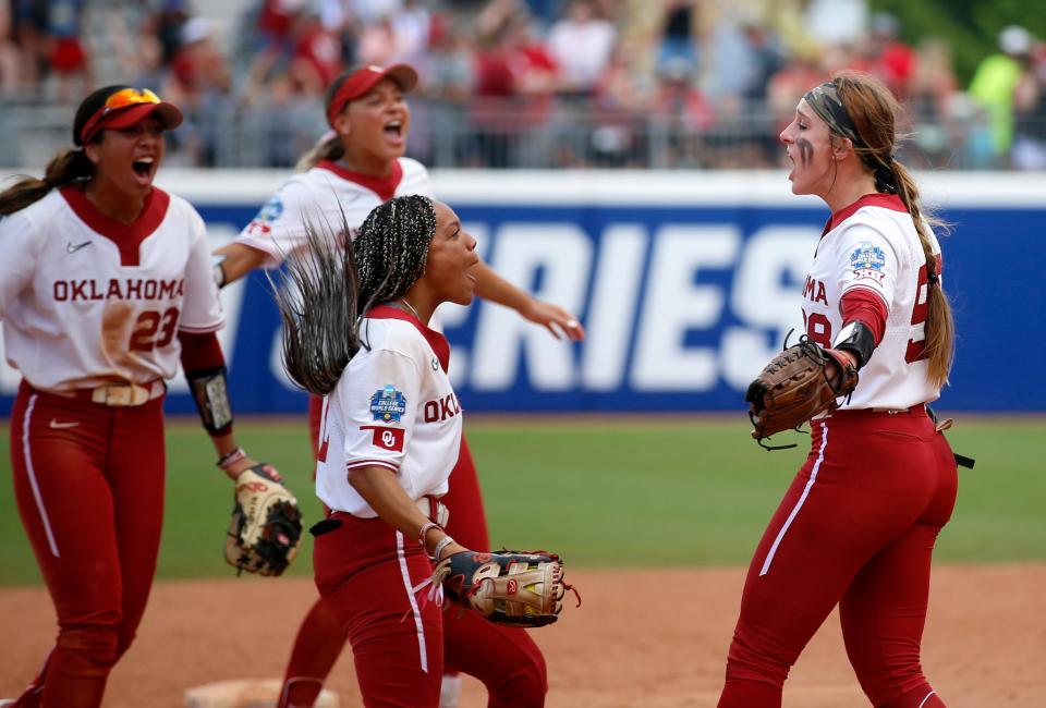 Oklahoma players celebrate after defeating Stanford at the Women's College World Series at USA Softball Hall of Fame Stadium in Oklahoma City.