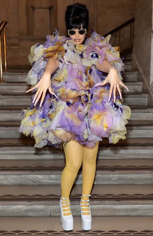 <p>Dimitrios Kambouris/Getty</p> Cardi B shows off her mani at the Marc Jacobs fall 2024 show