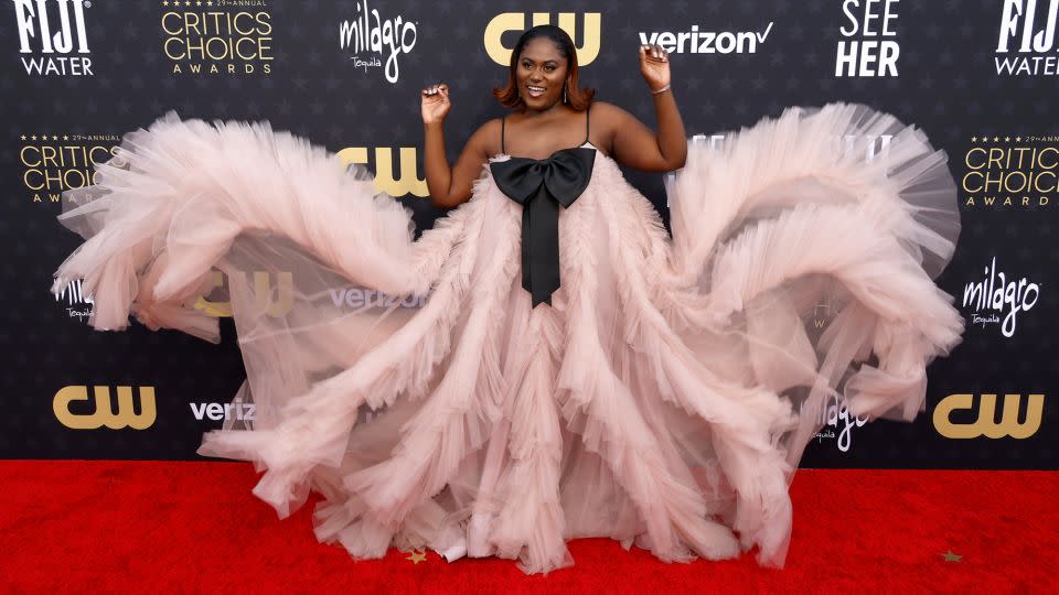 "The Color Purple" star Danielle Brooks wore a voluminous organza gown, by Monsoori, with a playful statement bow. - Frazer Harrison/Getty Images