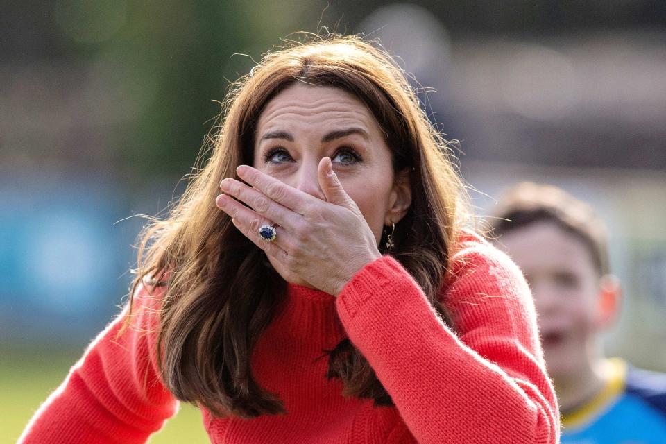 Britain's Catherine, Duchess of Cambridge, reacts after hitting the ball whilst attempting to play hurling during a visit to Salthill Gaelic Athletic Association (GAA) club in Galway, western Ireland, on March 5, 2020 on the final day of their three day visit. (Photo by Paul Faith / AFP) (Photo by PAUL FAITH/AFP via Getty Images)