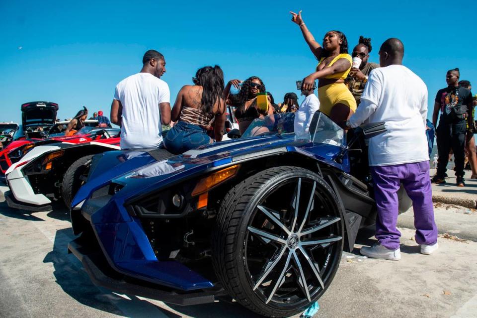 Spring breakers dance on cars during Black Spring Break in Biloxi on Saturday, April 9, 2022.