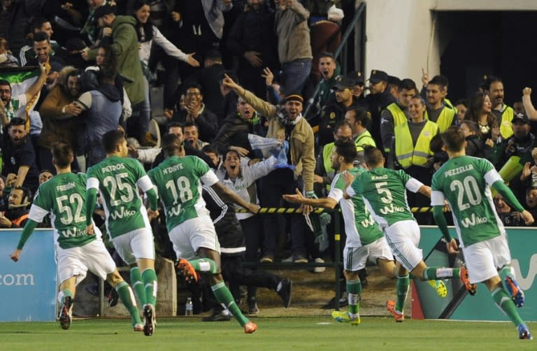 Real Betis' Alvaro Cejudo (C) celebrates after scoring a goal during their Spanish La Liga match against Real Madrid, at the Benito Villamarin stadium in Sevilla, on January 24, 2016