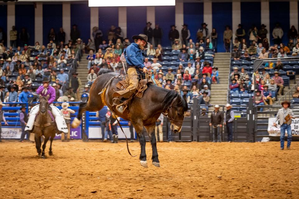 Jacob Lewis of W.T. Waggonner Estate Inc. leads the first go around of the Ranch Bronc Riding with a score of 84 during Thursday's performance of the 2023 WRCA World Championship Ranch Rodeo. The rodeo continues at the Amarillo Civic Center through Sunday.
