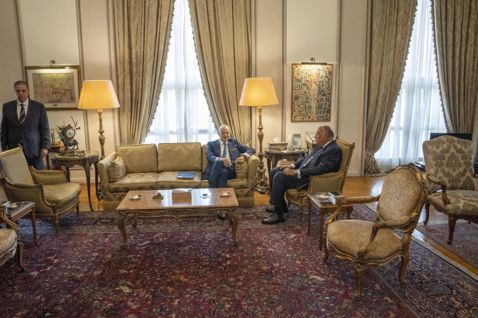 Egyptian Foreign Minister Sameh Shoukry, right, meets with Greek Foreign Minister Nikos Dendias , at the foreign ministry headquarters in Cairo, Egypt, Sunday, Oct. 9, 2022. (AP Photo/Nariman El-Mofty)