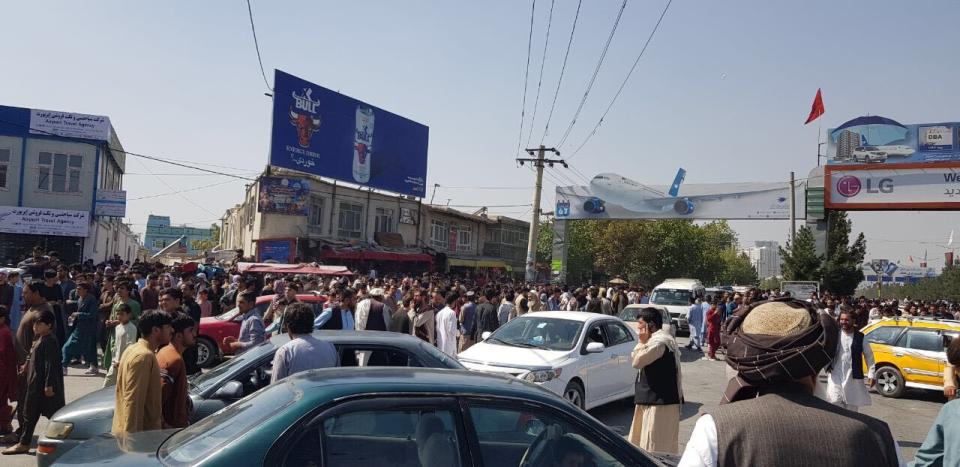 KABUL, AFGHANISTAN - AUGUST 16: Afghans crowd at the tarmac of the Kabul airport on August 16, 2021, to flee the country as the Taliban were in control of Afghanistan after President Ashraf Ghani fled the country. (Photo by Sayed Khodaiberdi Sadat/Anadolu Agency via Getty Images)