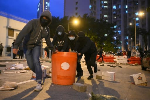 Residents set up barricades near the vacant Fai Ming Estate to protest against plans for the estate to be used as a quarantine camp for patients and frontline medical staff of the Novel Coronavirus