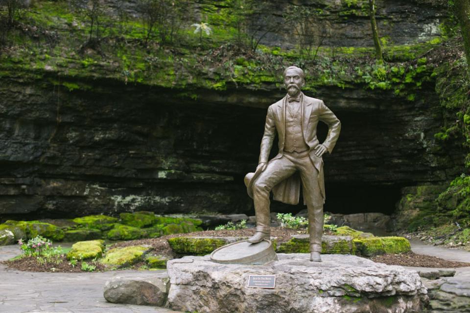 A statue of Jack Daniel in Lynchburg, Tenn. <a href="https://www.gettyimages.com/detail/news-photo/febuary-2018-usa-lynchburg-a-sculpture-in-front-of-the-cave-news-photo/981637014?adppopup=true" rel="nofollow noopener" target="_blank" data-ylk="slk:Kyle Dean Reinford/Picture Alliance via Getty Images;elm:context_link;itc:0;sec:content-canvas" class="link ">Kyle Dean Reinford/Picture Alliance via Getty Images</a>