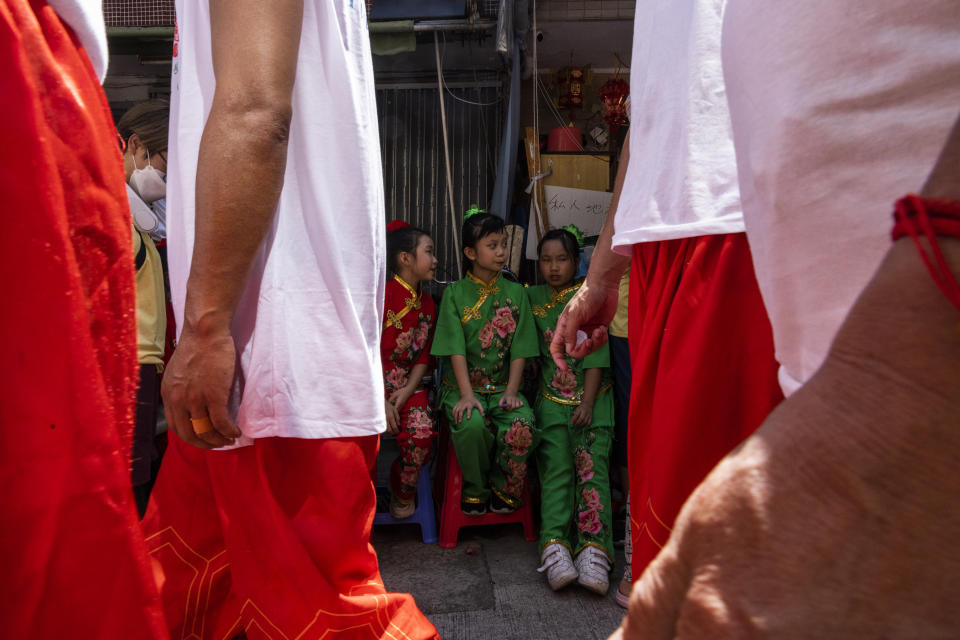 Participants take part in the Piu Sik Parade at the Bun Festival in Cheung Chau Island in Hong Kong, Friday, May 26, 2023. (AP Photo/Louise Delmotte)