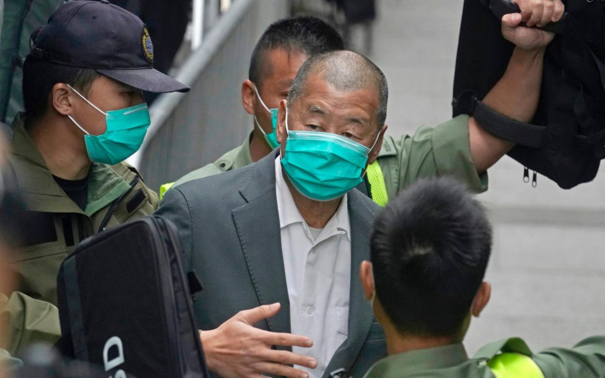 Jimmy Lai, center, leaves the Hong Kong's Court of Final Appeal in Hong Kong. Lai was sentenced to more jail time Friday, May 28, 2021 over his role in an anti-government protest in 2019, as authorities crack down on dissent in the city. - AP