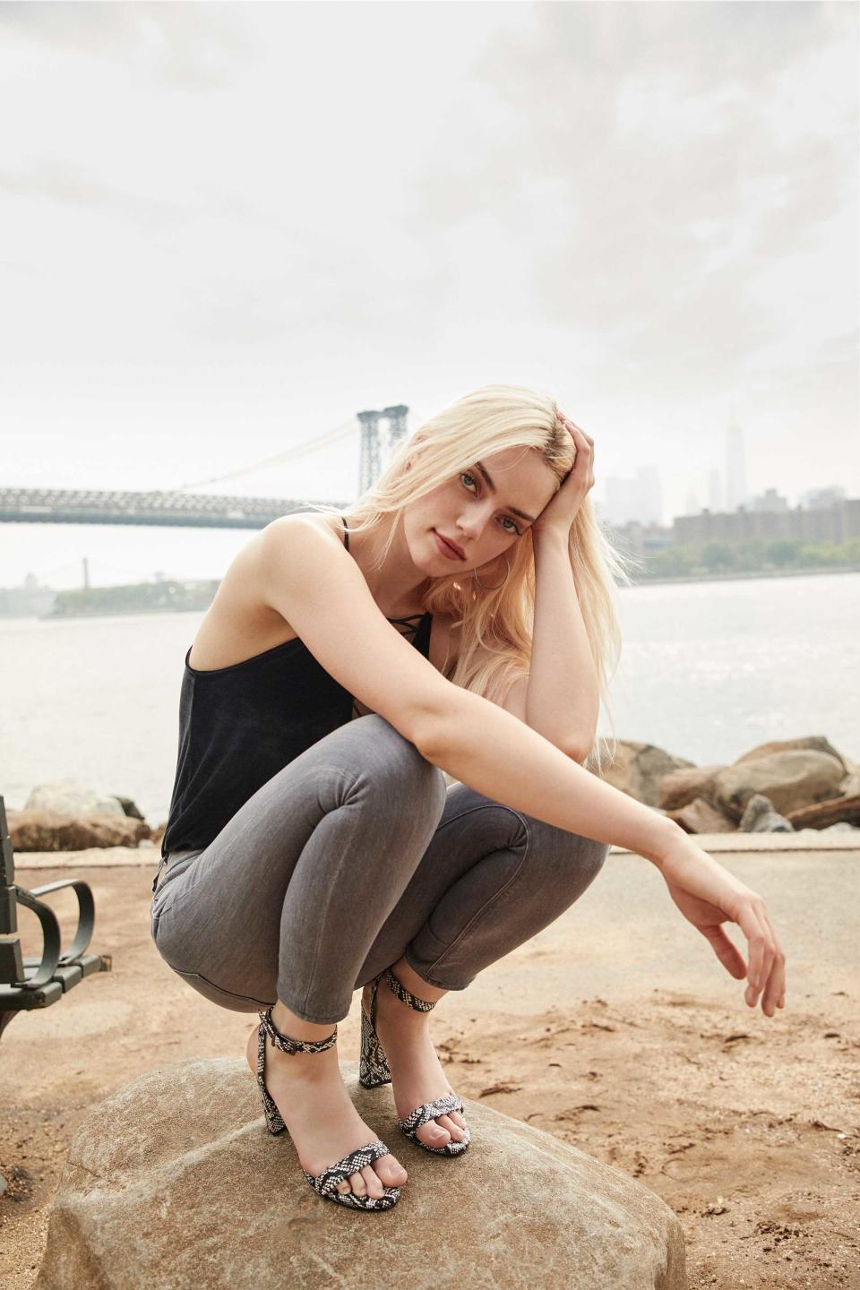 Pyper America Smith wears grey skinny Express Jeans with black tank and heel sandals. (Photo: courtesy of Express)