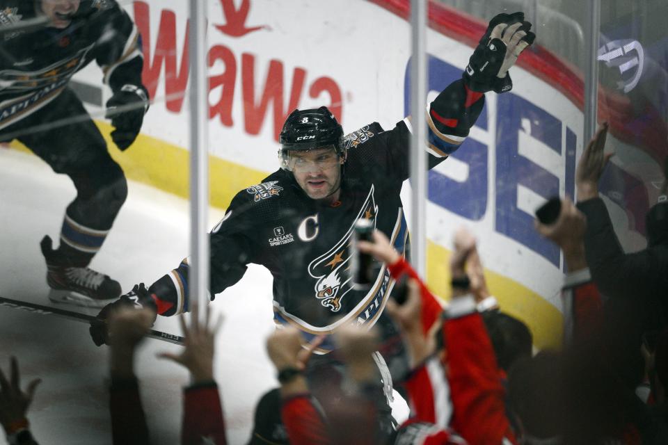 Washington Capitals left wing Alex Ovechkin (8) celebrates his goal during the first period of an NHL hockey game against the Winnipeg Jets, Friday, Dec. 23, 2022, in Washington. This was Ovechkin's 801st NHL goal. (AP Photo/Nick Wass)