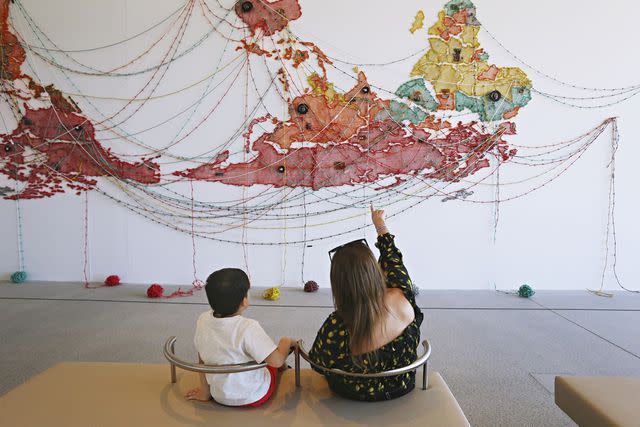 <p>Lisa Maree Williams/Getty Images</p> Visitors at Naala Badu, part of the Art Gallery of New South Wales.