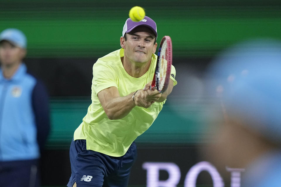 Tommy Paul, of the United States, returns to Daniil Medvedev, of Russia, during a semifinal match at the BNP Paribas Open tennis tournament, Saturday, March 16, 2024, in Indian Wells, Calif. (AP Photo/Mark J. Terrill)