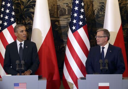 U.S. President Barack Obama addresses during a joint press conference with Poland's President Bronislaw Komorowski (R) at Belveder Palace in Warsaw June 3, 2014. Obama said on Tuesday he had come to Poland to affirm U.S. commitment to its security and called on the U.S. Congress to support up to $1 billion in funding to reassure eastern European allies about Washington's support. REUTERS/Kuba Atys/Agencja Gazeta