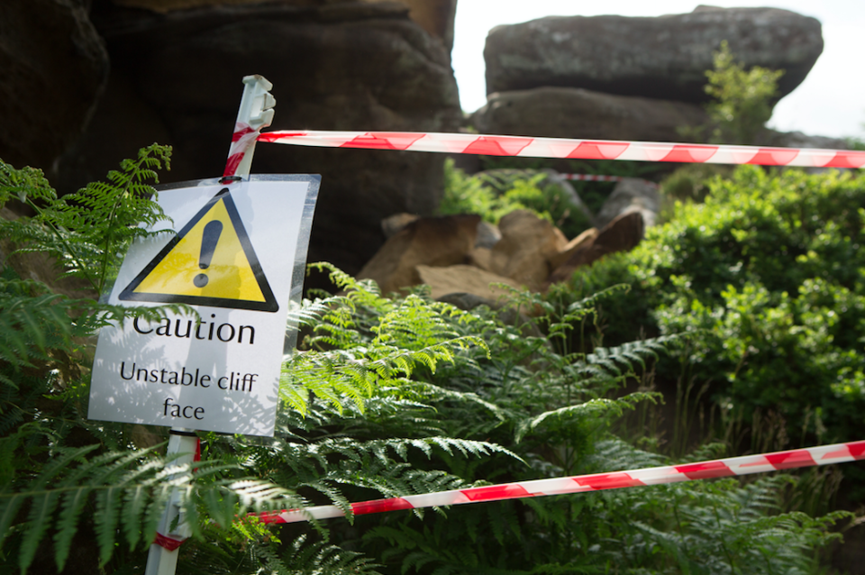 <em>Five youths were spotted pushing the rock off the crag at the National Trust owned tourist spot (SWNS)</em>